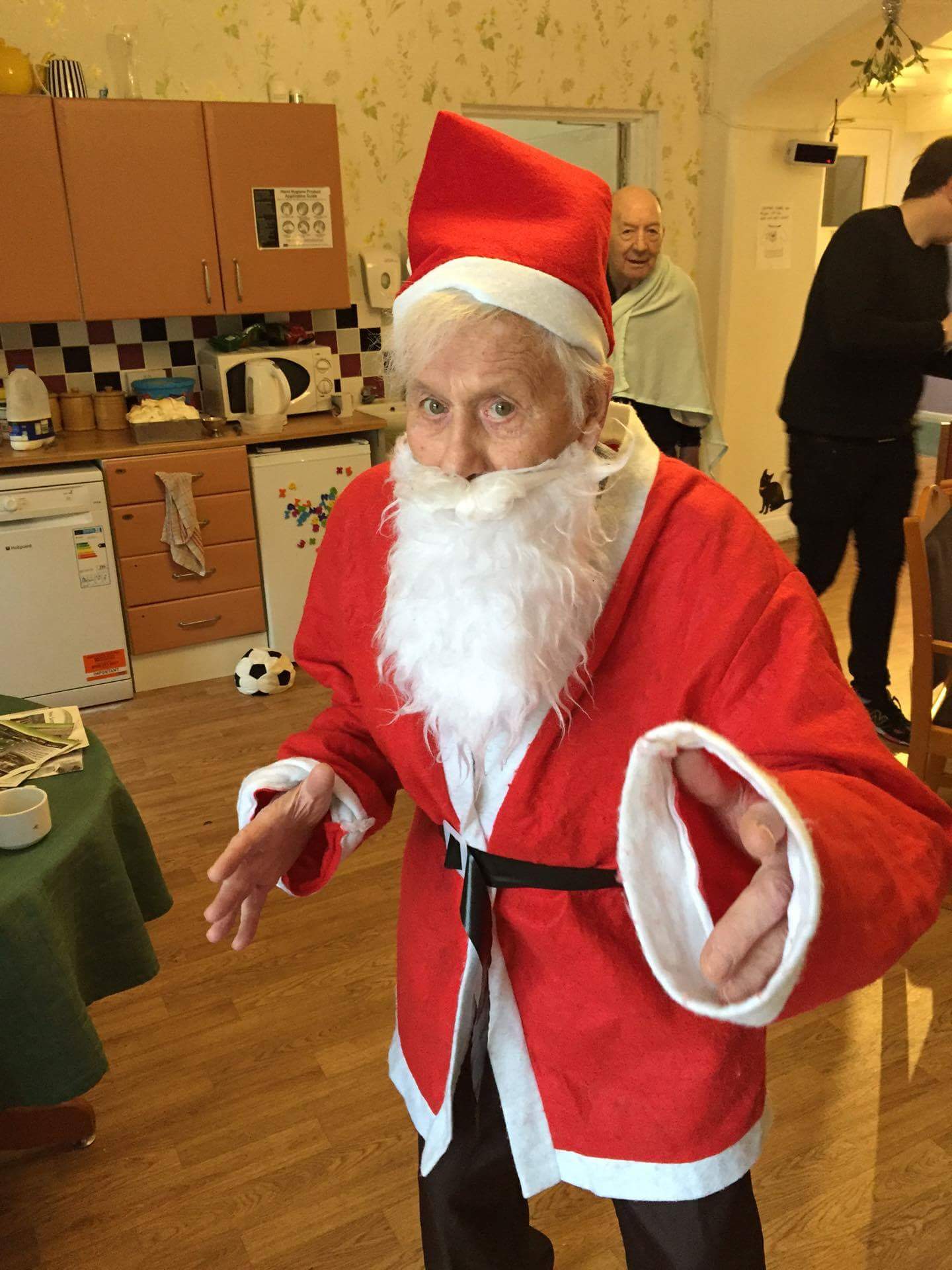 an elderly man dressed as Santa